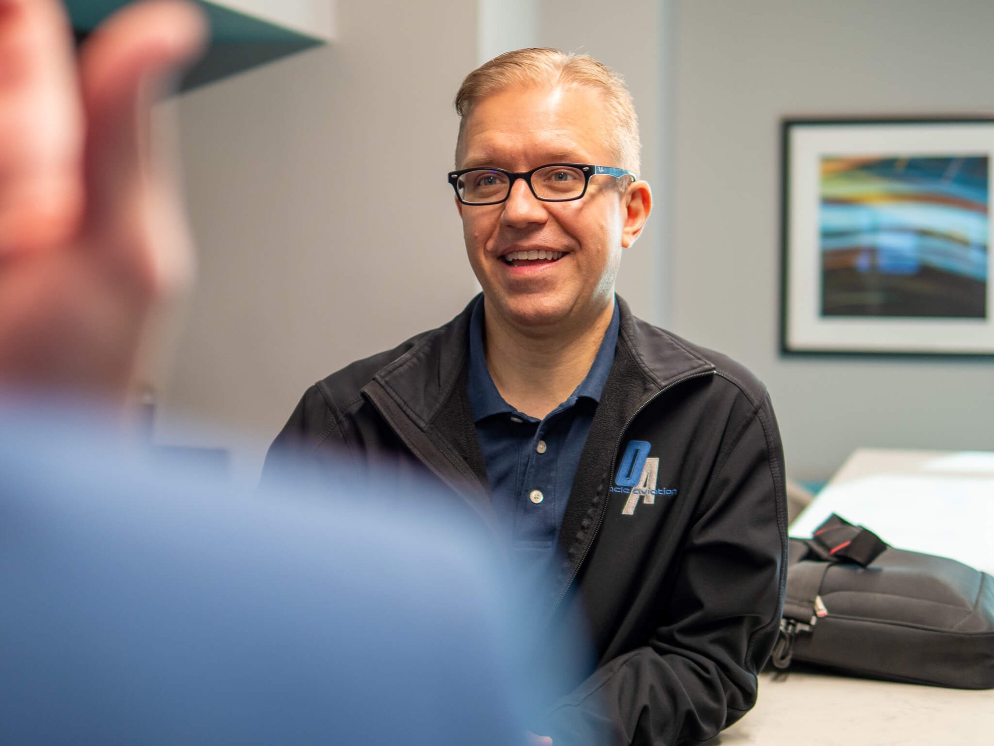 Dr. Barry Webber smiling at his yearly planning meeting at Four Quadrants Advisory.