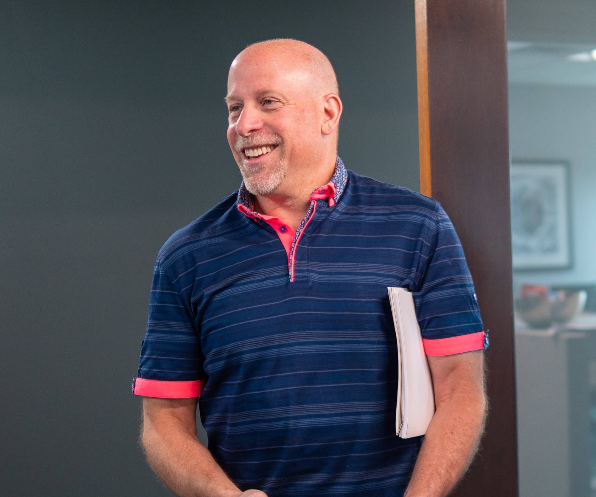 Dr. David Salomons smiling at his yearly planning meeting at Four Quadrants Advisory.