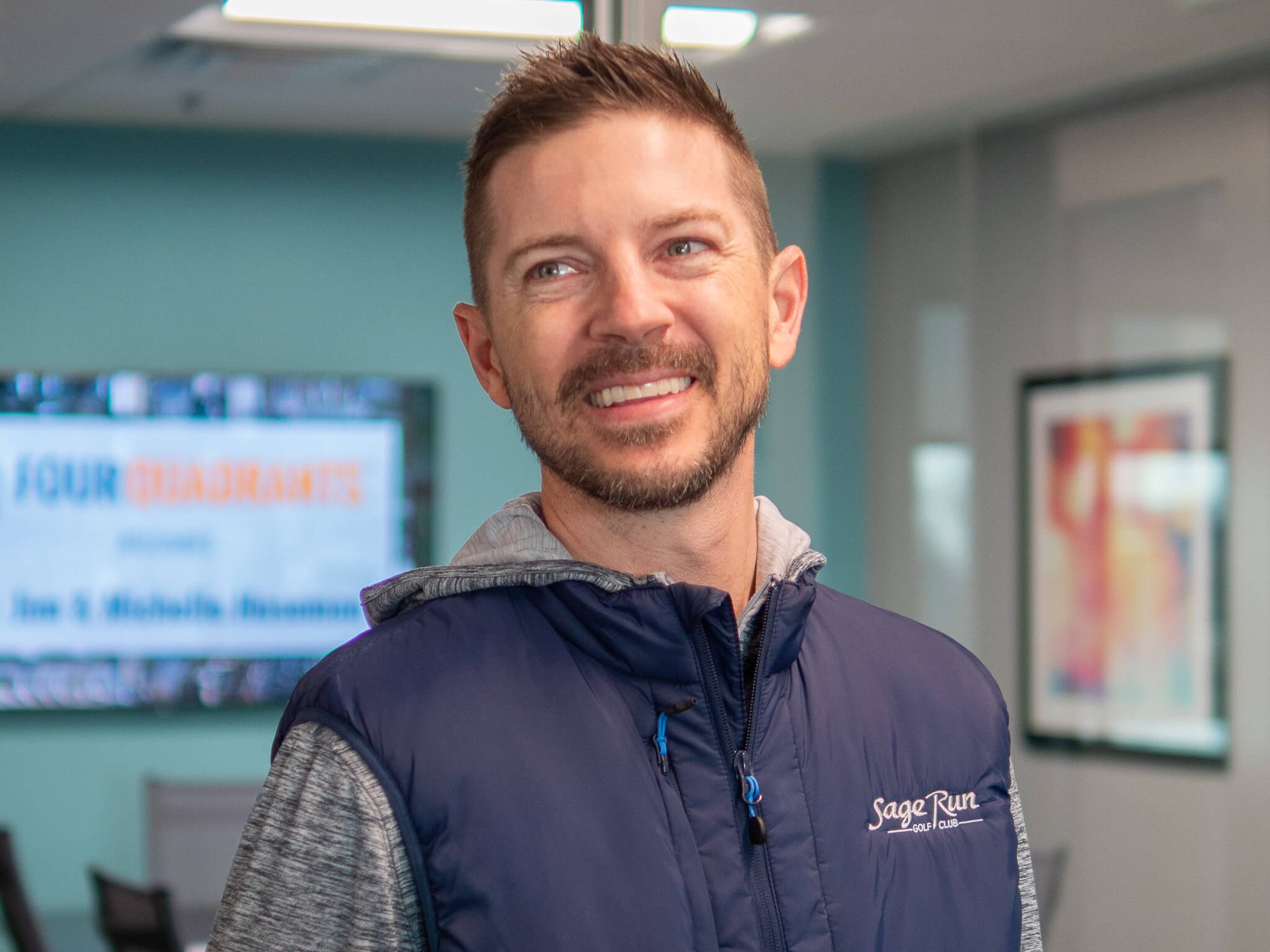 Dr. James Huseman smiling at his yearly planning meeting at Four Quadrants Advisory.