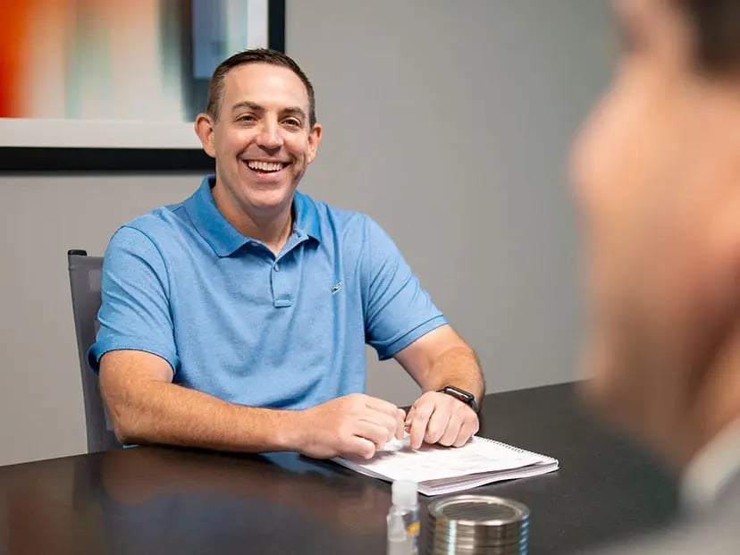Dr. Wes Booker smiling at his yearly planning meeting at Four Quadrants Advisory.