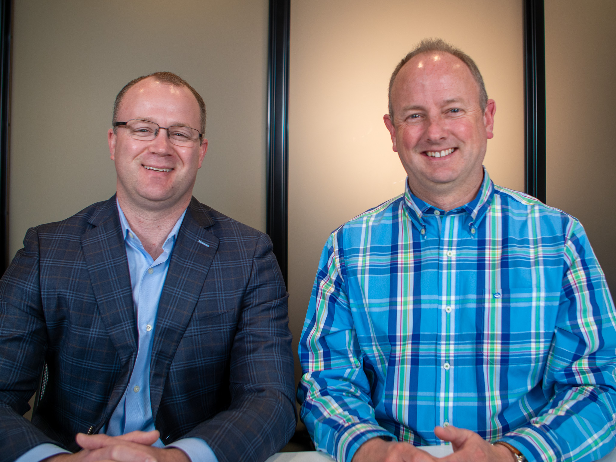 Dr. Todd Christy and Dr. Eric Balsis smiling at their yearly planning meeting at Four Quadrants Advisory.