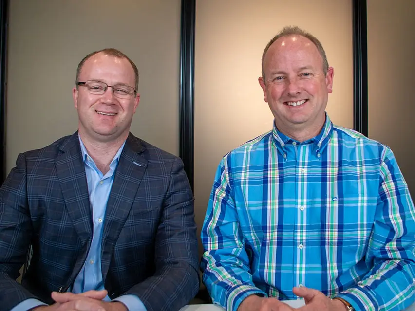 Dr. Todd Christy and Dr. Eric Balsis smiling at their yearly planning meeting at Four Quadrants Advisory.