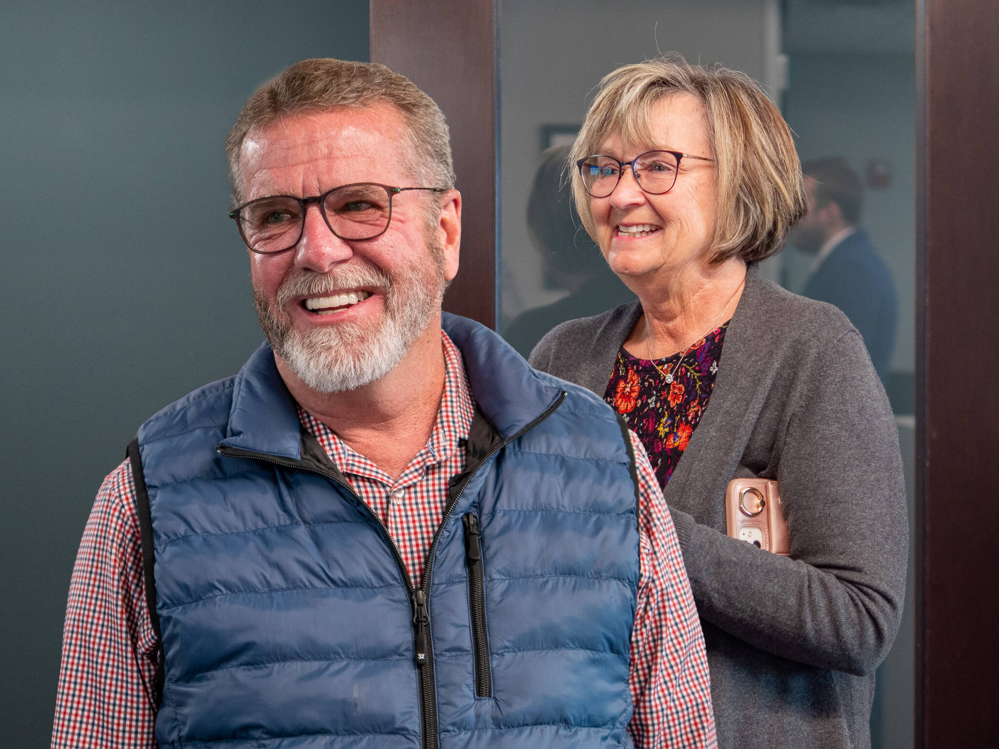 Dr. Ron and Mary Bryant smiling at their yearly planning meeting at Four Quadrants Advisory.