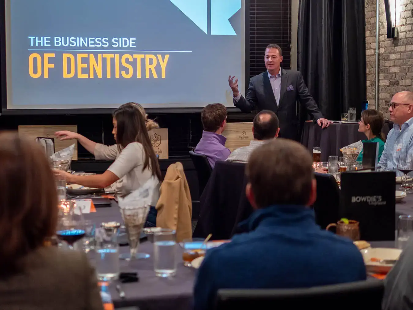 Casey Hiers presenting a dental-specific CE course to dentists.