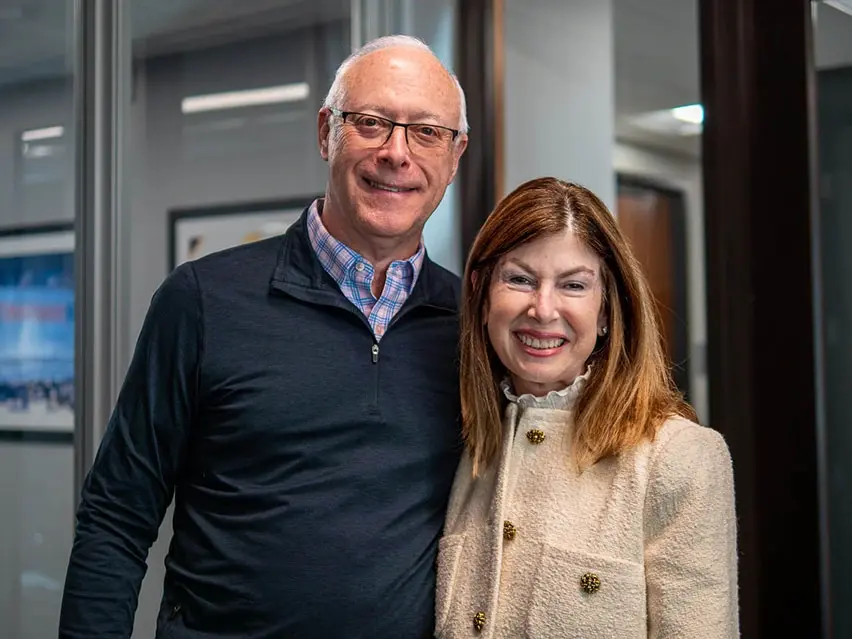 Dr. Larry and Suzy Falender smiling at their yearly planning meeting at Four Quadrants Advisory.