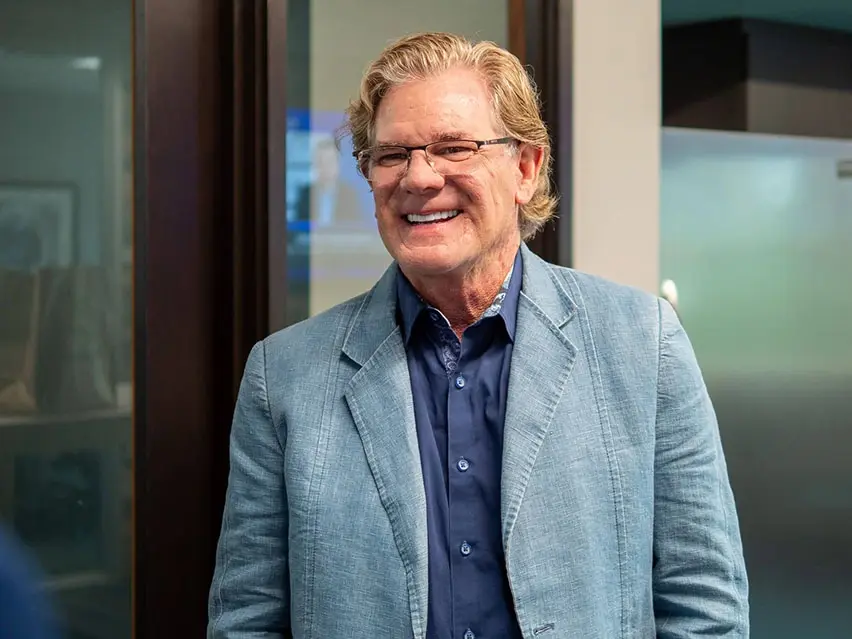 Dr. Scott Anderson smiling at his yearly planning meeting at Four Quadrants Advisory.