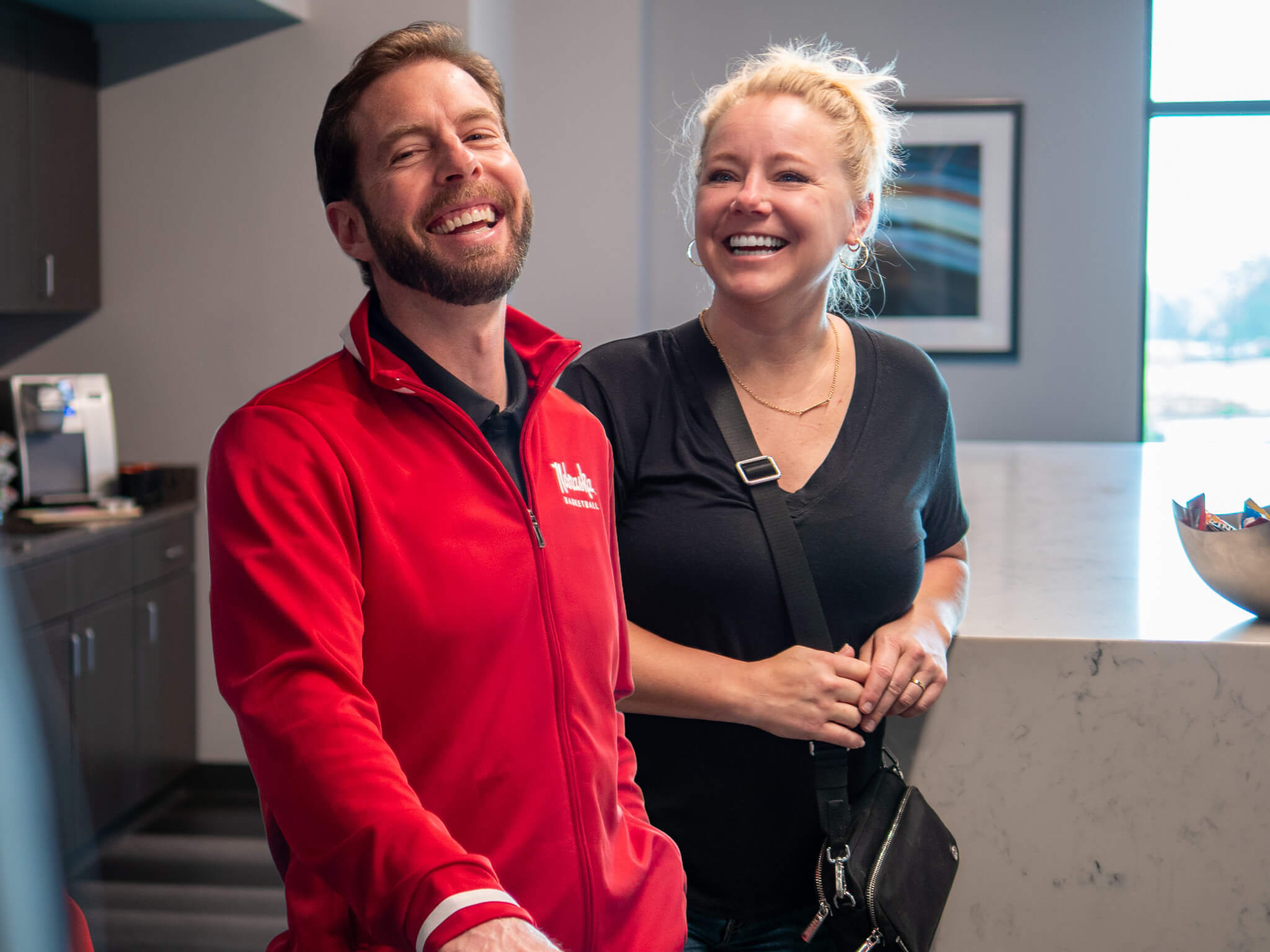 Dr. Ryan and Martha Thomas smiling at their yearly planning meeting at Four Quadrants Advisory.