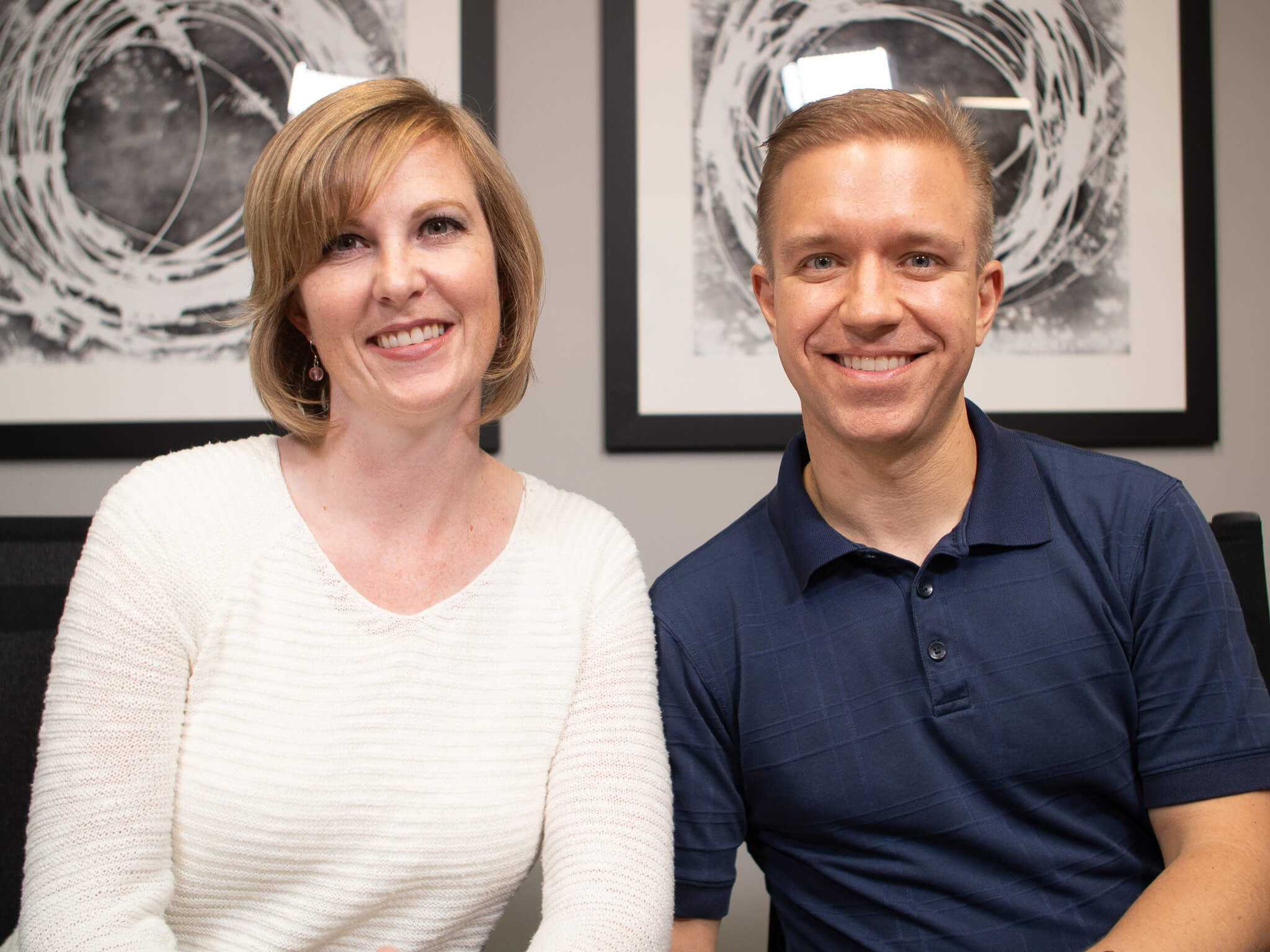 Dr. Barry and Cara Webber smiling at their yearly planning meeting at Four Quadrants Advisory.